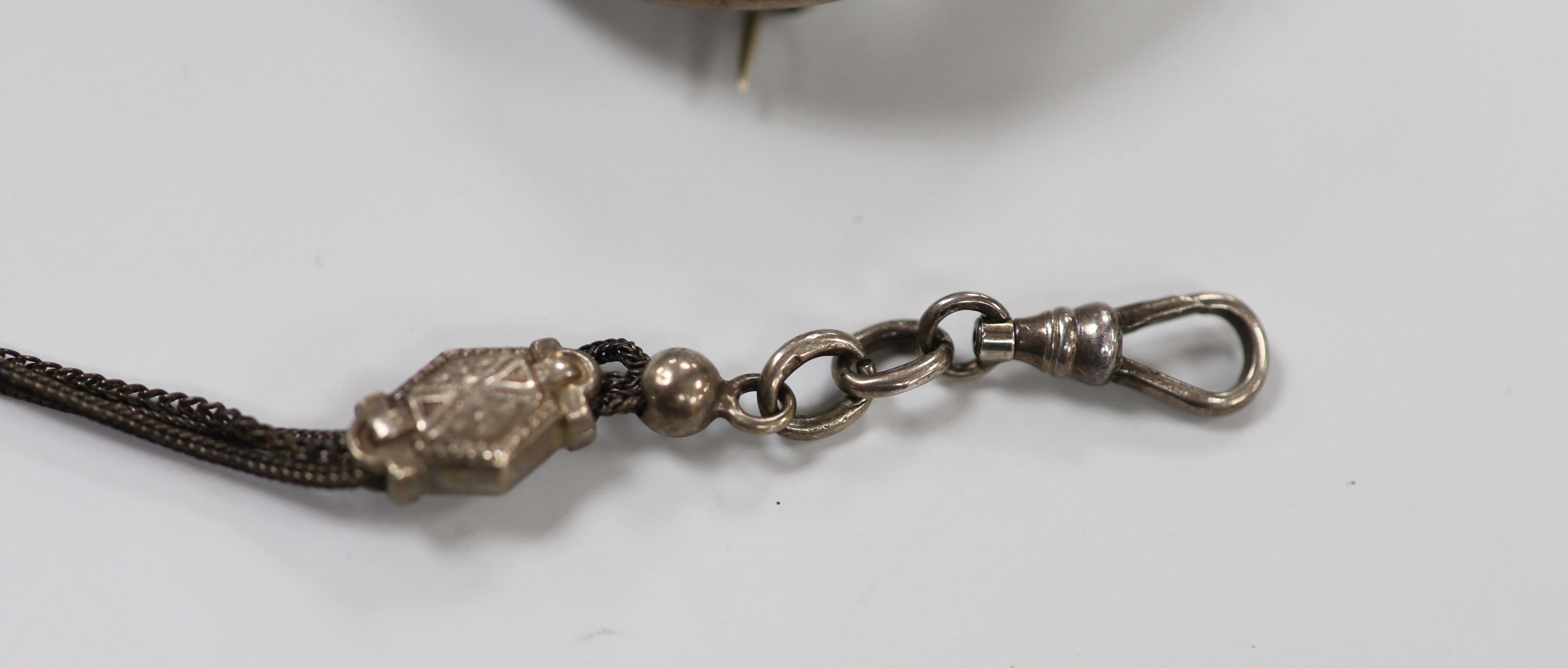 Two white metal and Scottish hardstone set brooches, largest 51mm, two coin set bracelet and a fob chain.